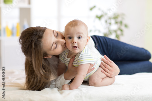 Mom kissing her little son ...