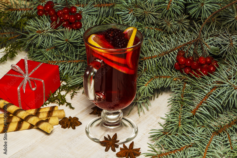 Christmas hot mulled wine with cinnamon cardamom and anise on a wooden background Christmas hot mulled wine with cinnamon cardamom and anise on a wooden background