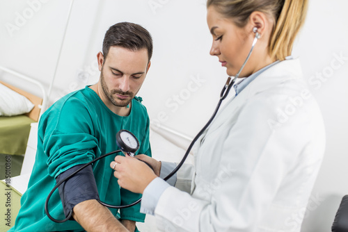 Female doctor checking bloo...
