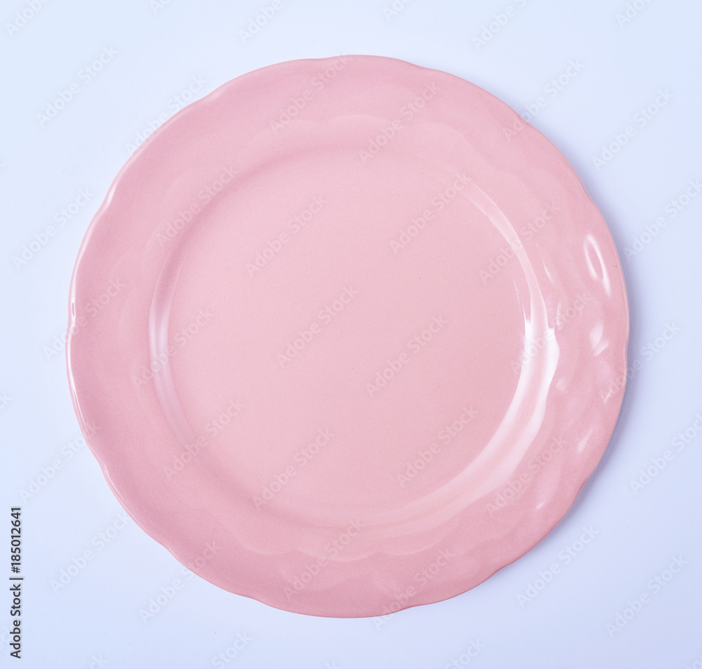 Empty ceramic round plate isolated on white background Empty ceramic round plate isolated on white background