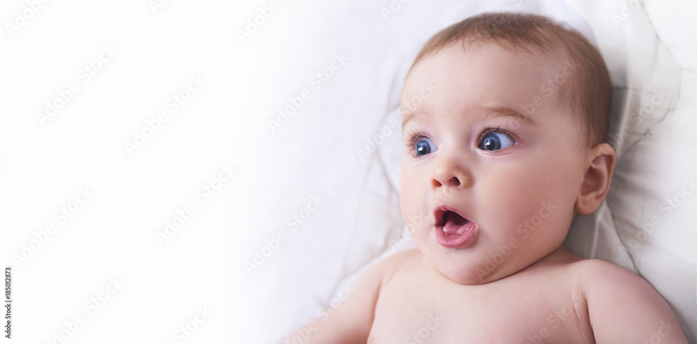 Surprised kid. Child's eyes widened and mouth opened in amazement. copy space for your text