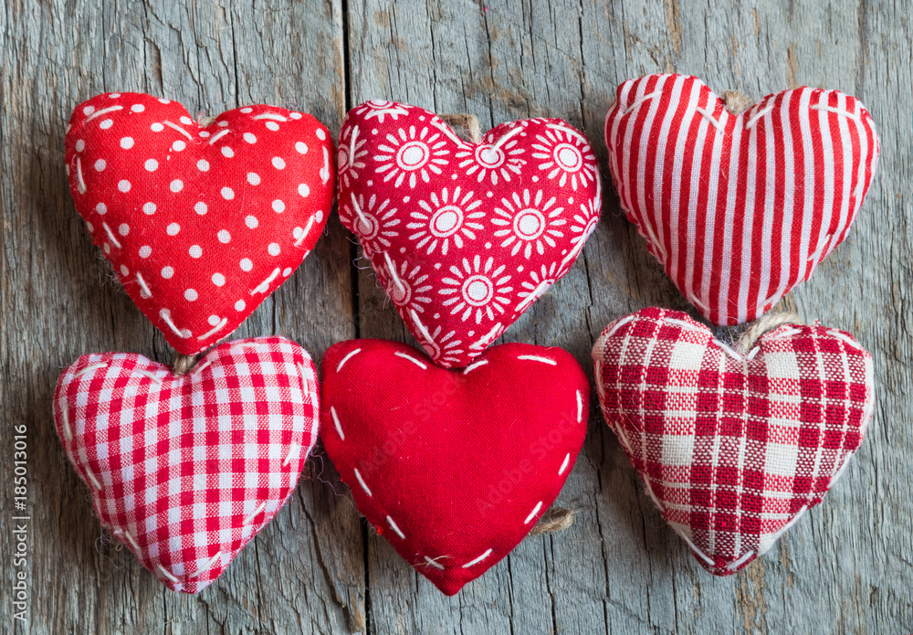 Various hearts on wooden surface Various hearts on wooden surface