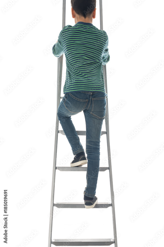 the boy climbs on a ladder to the purpose up