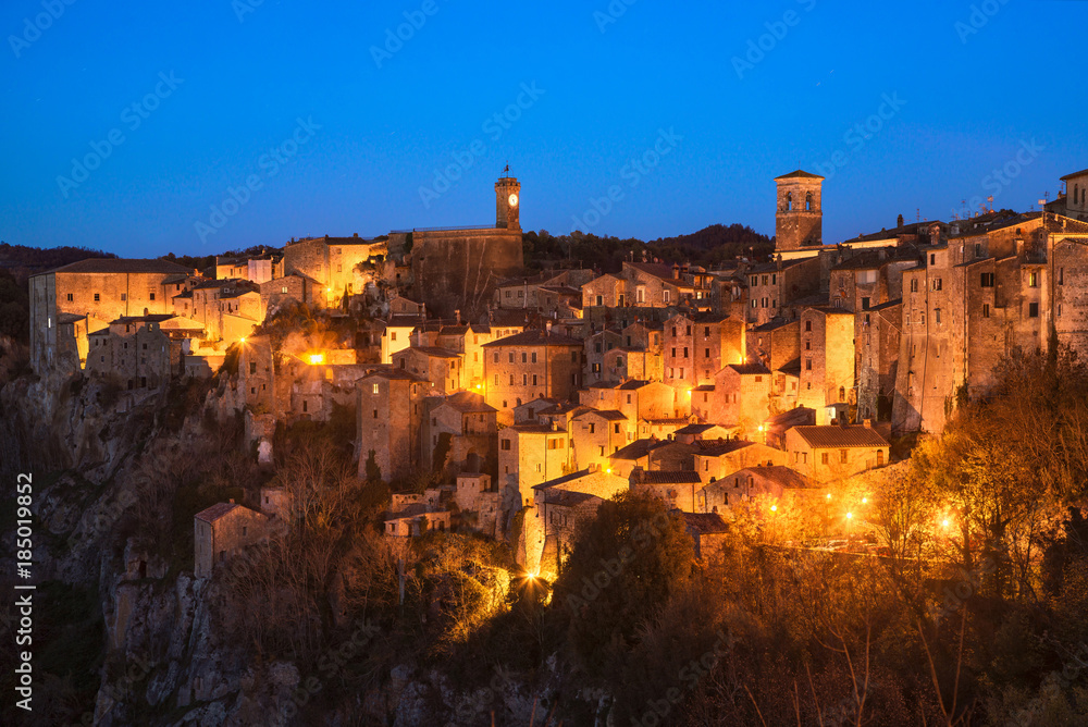 Tuscany, Sorano medieval village blue hour sunset panorama. Italy