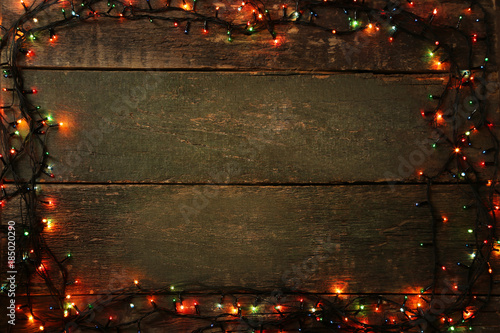 Christmas garland lights on grey wooden table