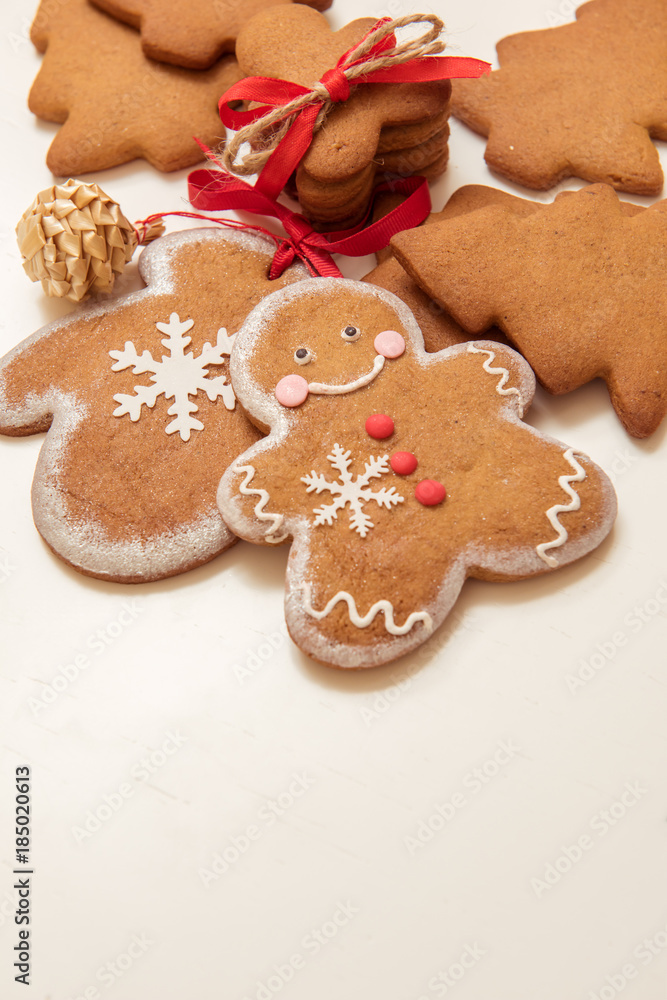 Smiling gingerbread man with other brown Christmas cookies Smiling gingerbread man with other brown Christmas cookies