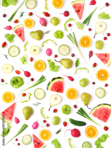 Pattern of vegetables and fruits. Abstract food background, top view, flat lay. Composition of pears, watermelon, peppers, apples, radishes and oranges isolated on a white background. Healthy eating.