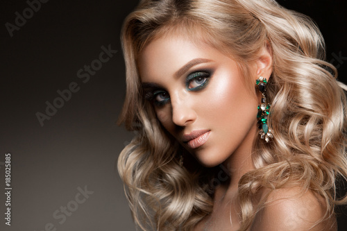 Beautiful woman with professional make up and hairstyle