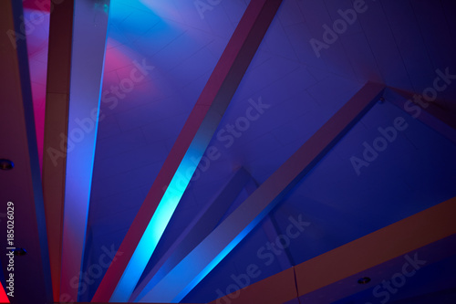 Abstraction. Beams under Polycom with coloured lights. Beautiful rich colors photo