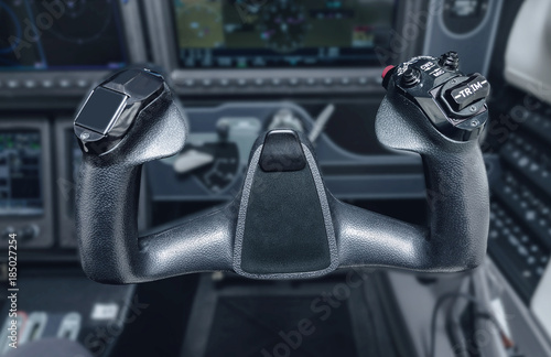 Inside the cockpit of the snall airplane. The steering wheel of the aircraft. photo