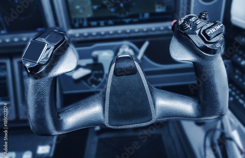 Inside the cockpit of the snall airplane. The steering wheel of the aircraft.