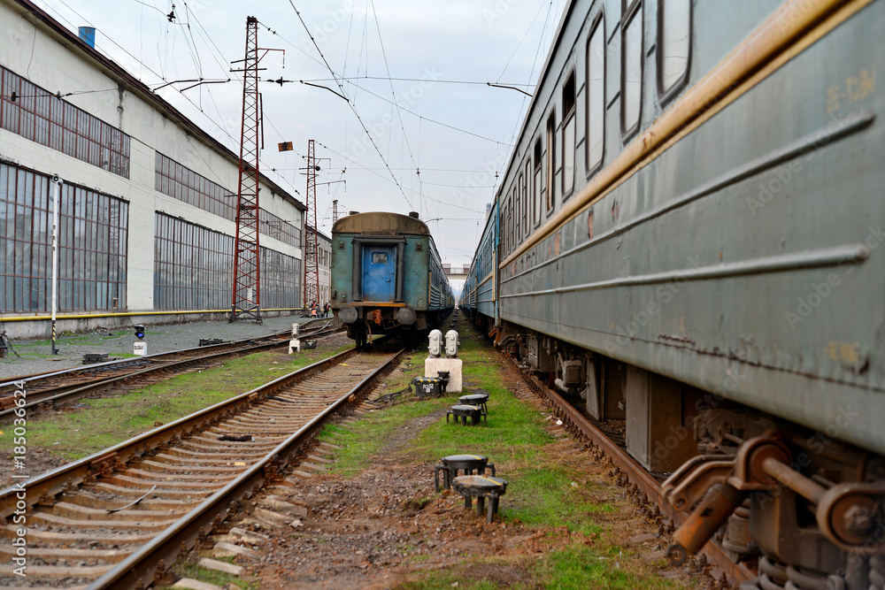 Obraz premium Passenger and freight train. Passenger diesel train traveling speed railway wagons journey light