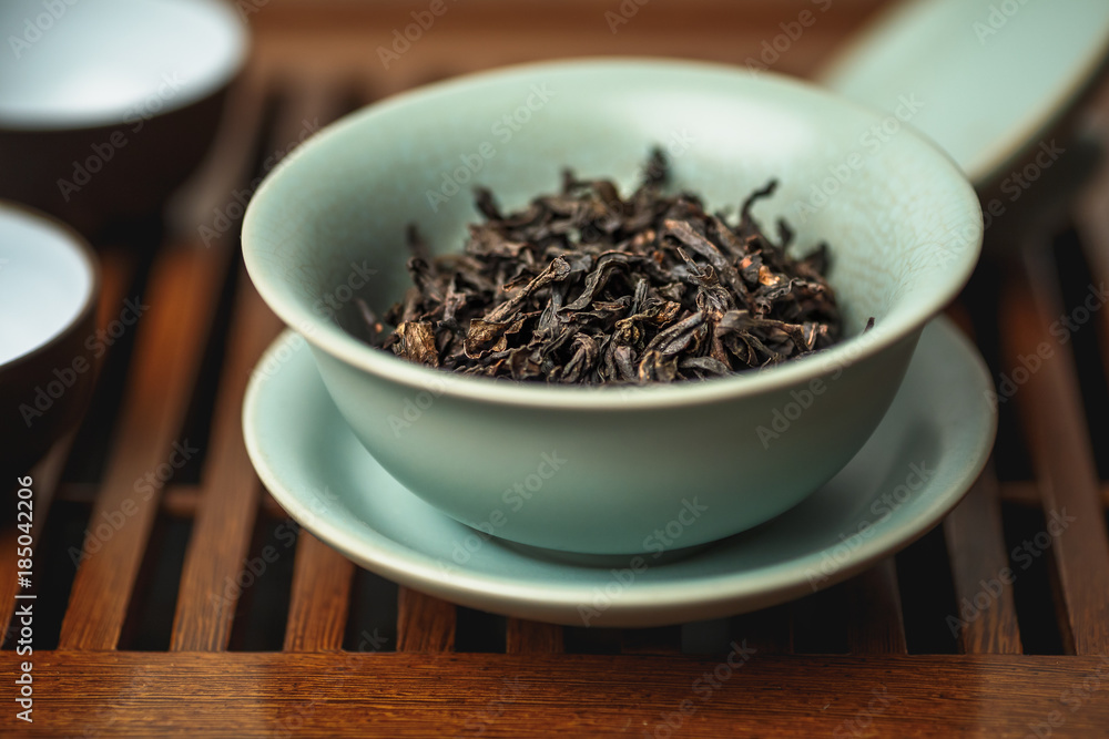 Chinese tea ceremony, da hong pao oolong tea in gaiwan or tea-cup Chinese tea ceremony, da hong pao oolong tea in gaiwan or tea-cup