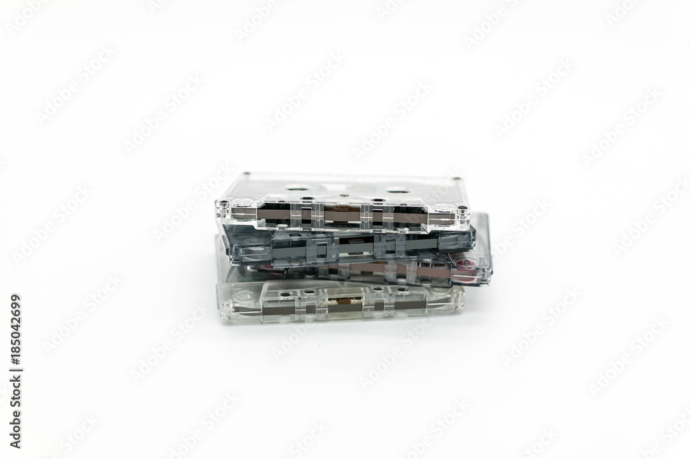 Pile of audio retro cassettes on a light background Pile of audio retro cassettes on a light background