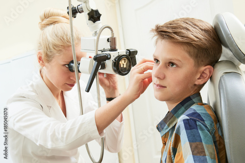 Ear, nose, throat examining. ENT doctor with a child patient and endoscope photo