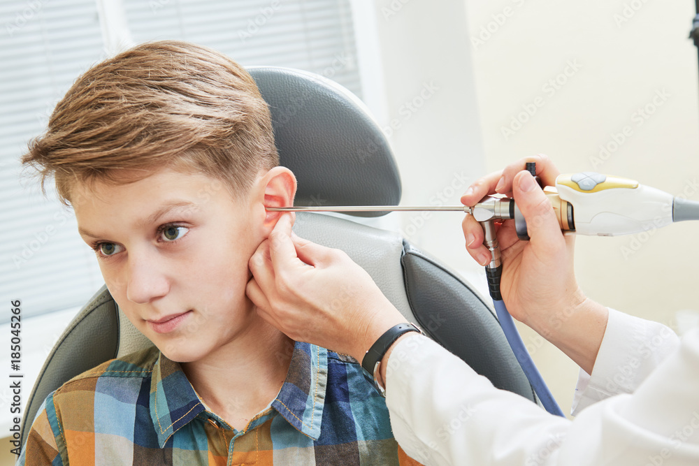 Ear, nose, throat examining. ENT doctor with a child patient and endoscope Ear, nose, throat examining. ENT doctor with a child patient and endoscope