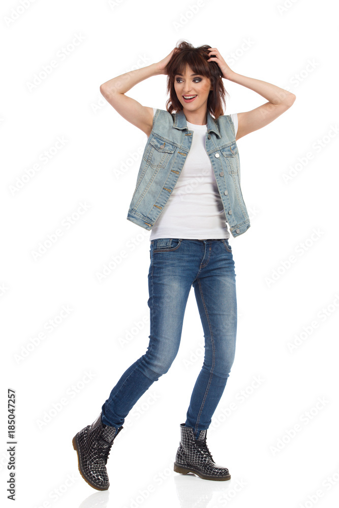 Surprised Happy Young Girl Is Standing Holding Head In Hands And Looking Away Surprised Happy Young Girl Is Standing Holding Head In Hands And Looking Away