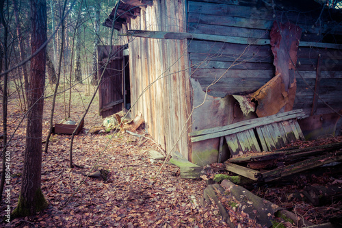 An old abandoned damaged wooden house