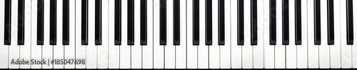 musical keyboard isolated, top view (more than four octaves) photo