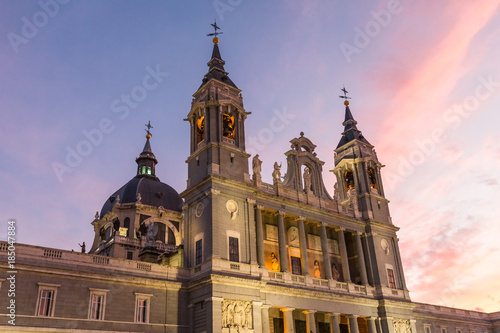 Almudena Cathedral at sunset, a Catholic church in Madrid, Spain. It is the seat of the Roman Catholic Archdiocese of Madrid.  © dadamira