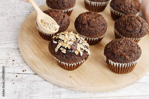 Chocolate muffins with oatmeal flakes.