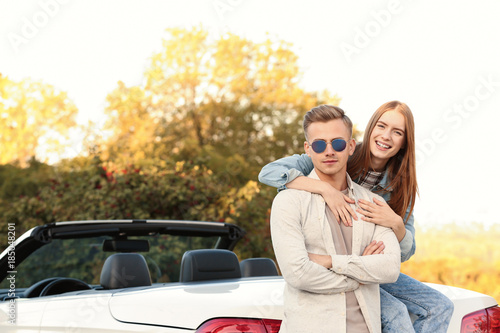 Happy young couple hugging ...