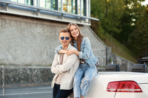 Happy young couple hugging ...