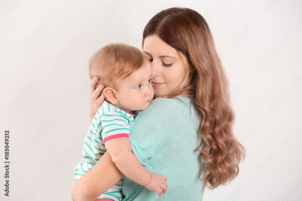 Young mother with baby on white background Young mother with baby on white background
