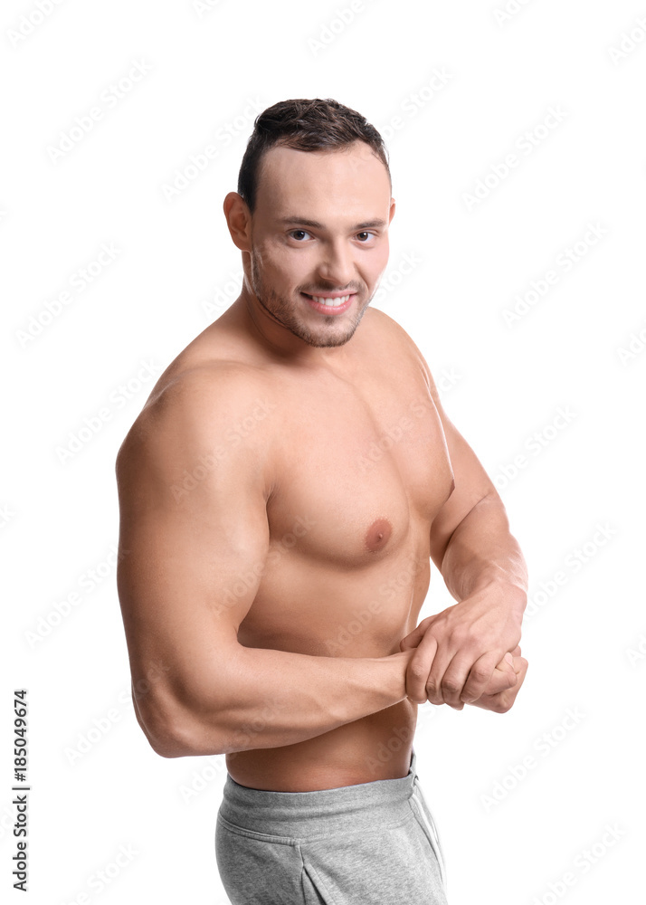 Muscular young bodybuilder on white background