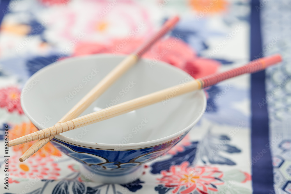 Close up of Chineese chopsticks on a rice bowl Close up of Chineese chopsticks on a rice bowl