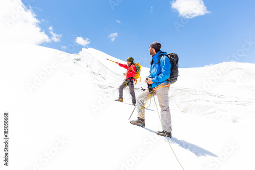 Two alpinists friends walking climbing ice glacier mountain Andes Peru