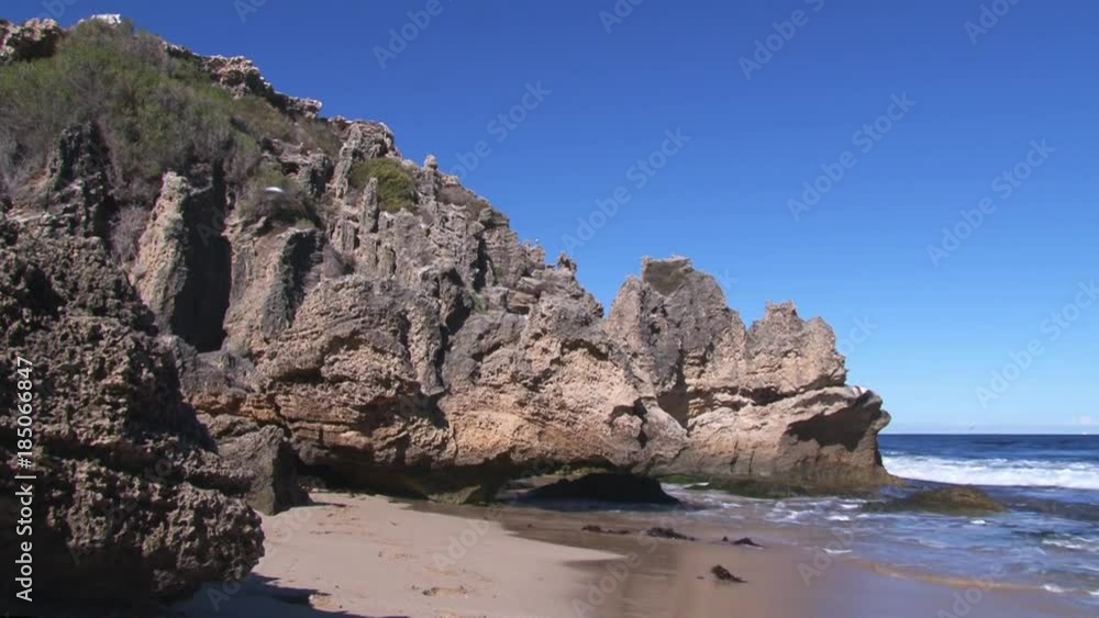 A full shot of a seashore and waves with sky A full shot of a seashore and waves with sky