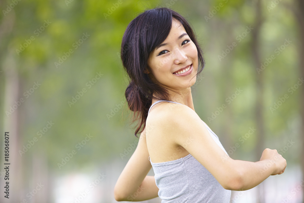 pretty young asian woman jogging outdoor