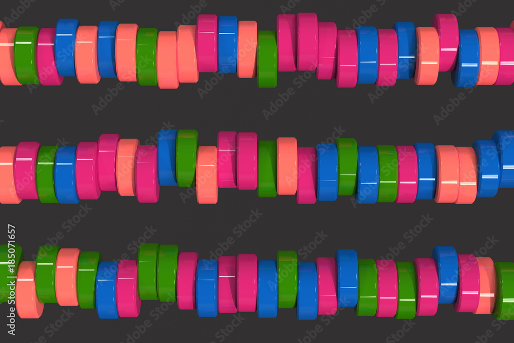 Fototapeta premium Pattern of blue, red and green cylinder tablets on black background