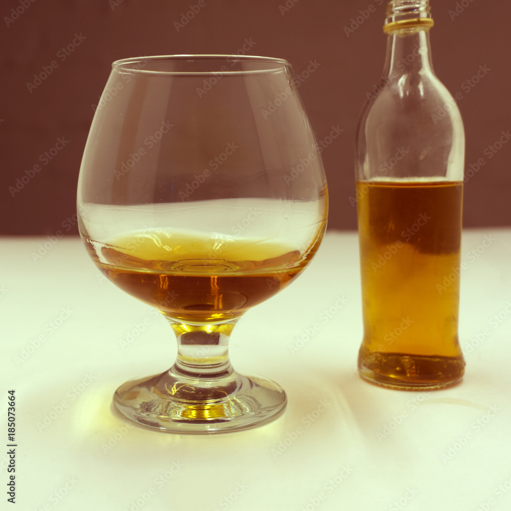 a glass of whiskey and capacity . a glass of whiskey and capacity .