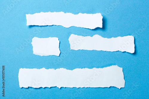 Pieces of white paper template for text on a blue background. Mock-up