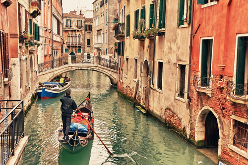 Gondola on canal in Venice © sborisov