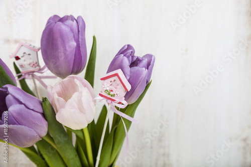 Bouquet of tulips on a wooden background.