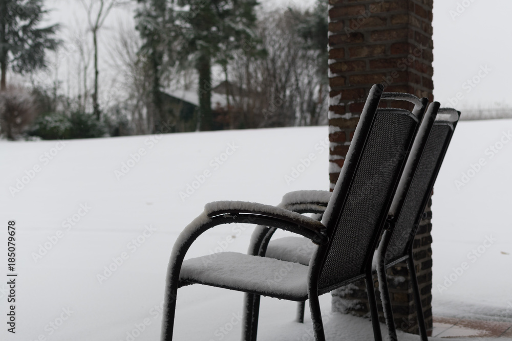 Snow covered chair