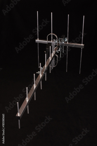 Yagi Uda antenna for UHF tv isolated on the black background photo