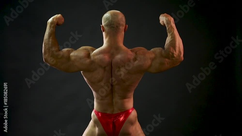 bodybuilder posing in studio