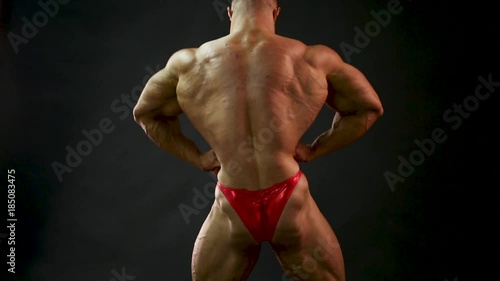 bodybuilder posing in studio