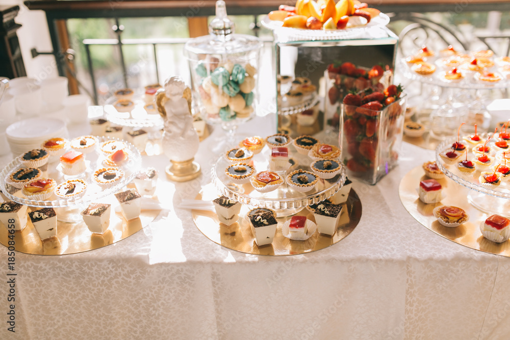 Sweet wedding buffet with different of desserts and fruits.