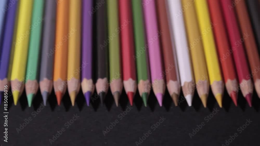 color pencils on a black background color pencils on a black background