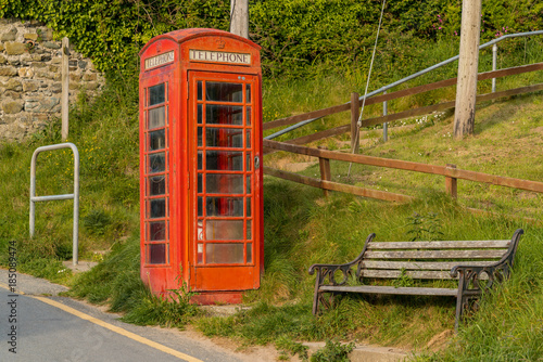 Telephone booth & bench, seen in Tresaith, near Cardigan, Ceredigion, Dyfed, Wales, UK photo