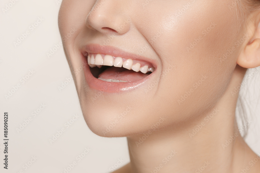 Beautiful and healthy woman smile, close-up Beautiful and healthy woman smile, close-up