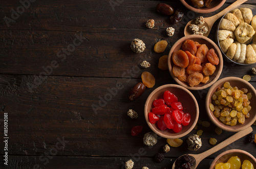 Dried fruits on wooden background