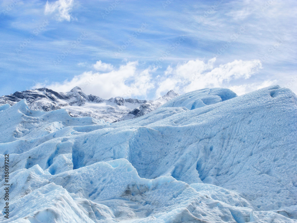 Blue ice background texture. Perito Moreno clear blue glacier close up in Los Glaciares National Park, Patagonia, Argentina, South America. Blue iceberg with Ice caves.