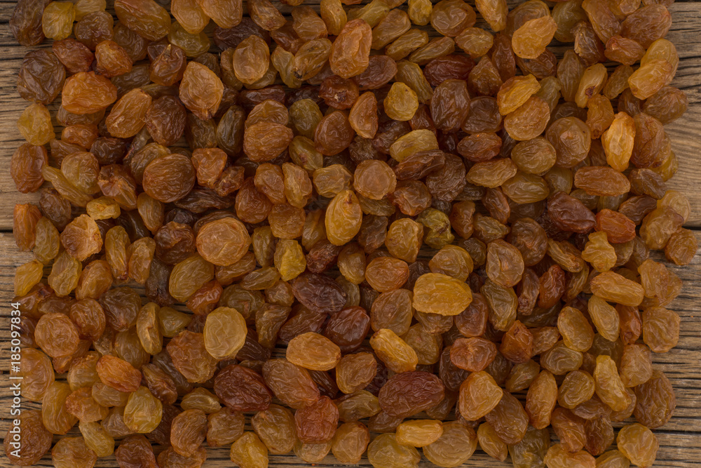 Raisins on the old wooden table. Raisins on the old wooden table.