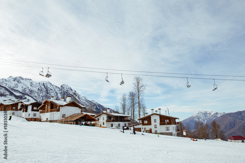   Ski resort, mountain slope. Wooden houses and elevator. Sochi, Rosa Khutor.
